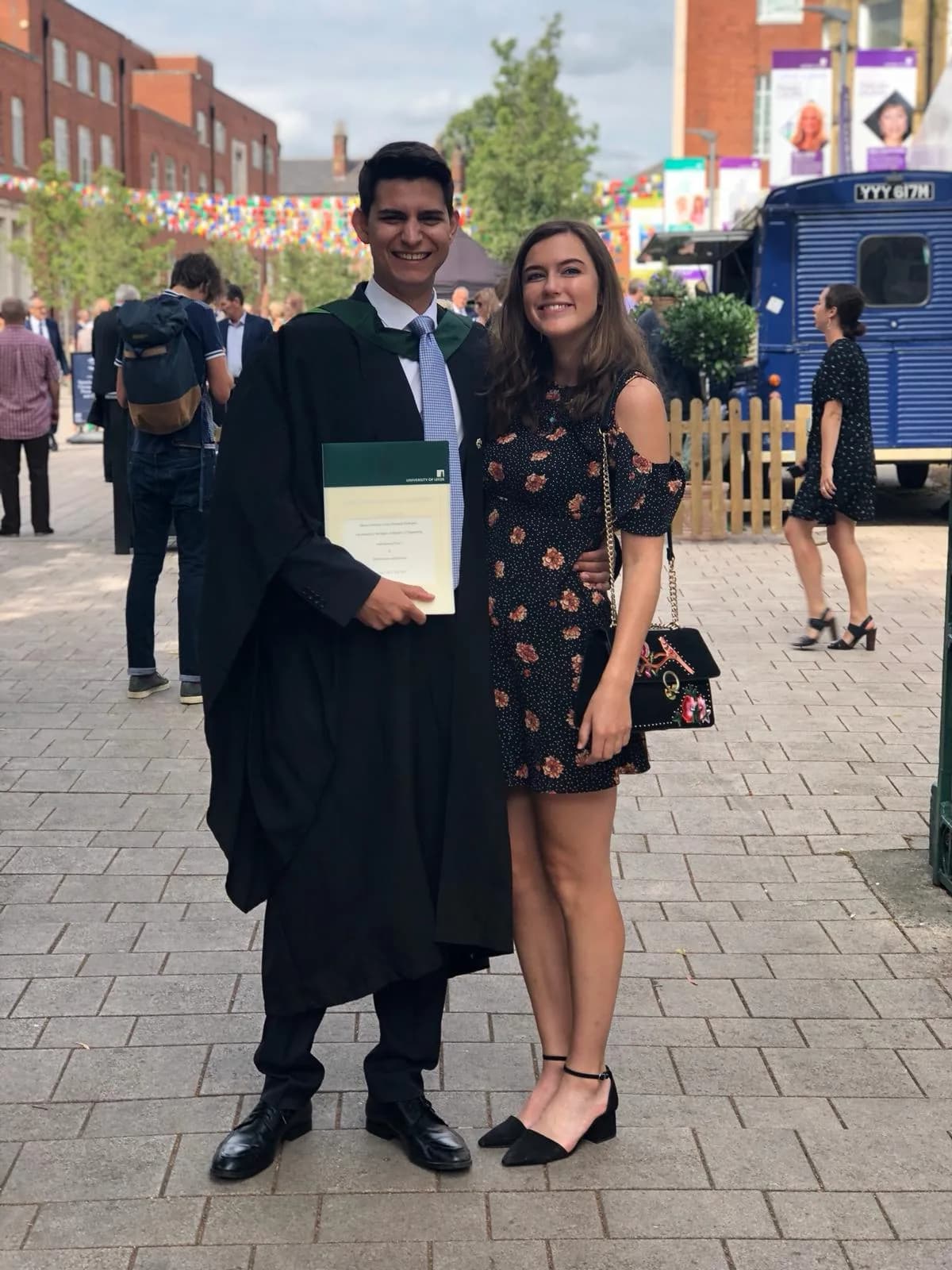 Mateo and Kirsty standing together after graduation ceremony