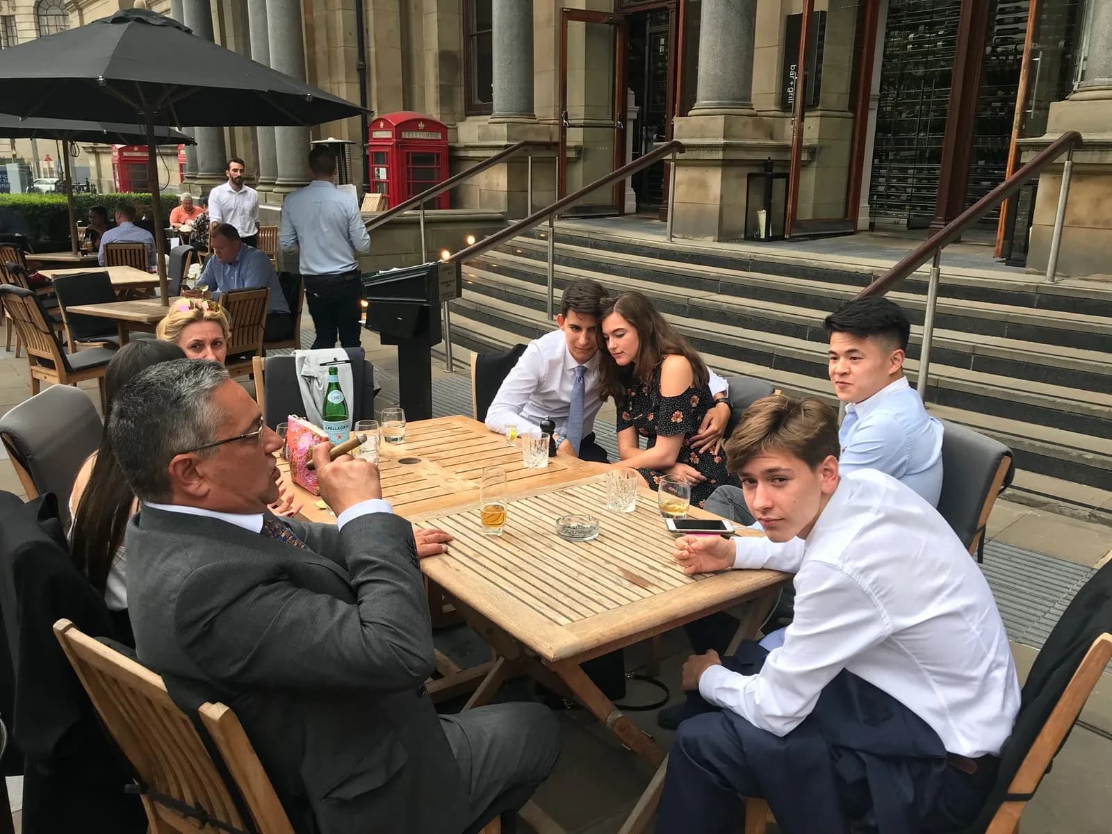 Family gathered at an outdoor terrace